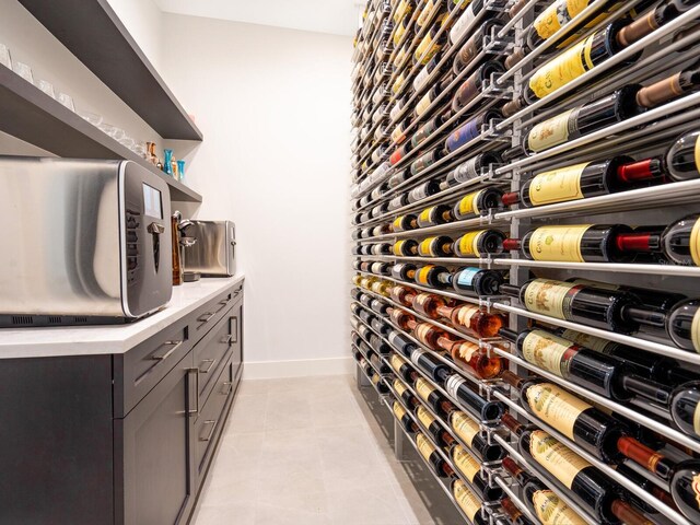 wine area featuring light tile patterned flooring