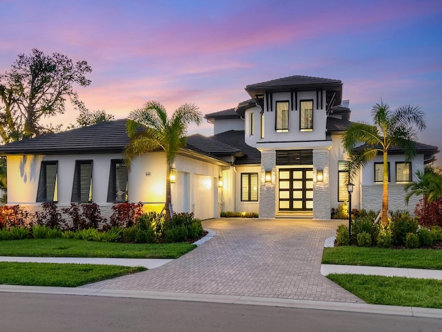 prairie-style home featuring a garage