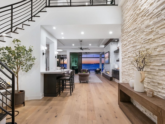 interior space featuring light hardwood / wood-style floors and ceiling fan