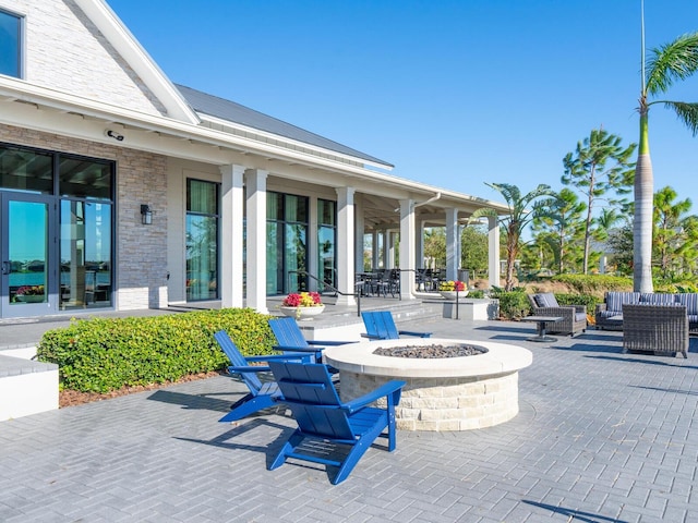 view of patio featuring an outdoor fire pit