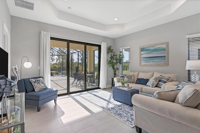 364 Palmaria Ct, Nokomis, FL 34275 - living area featuring a tray ceiling, healthy amount of natural light, and recessed lighting