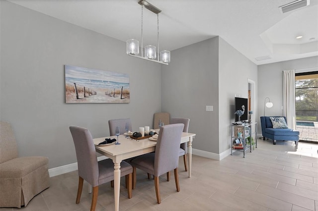 364 Palmaria Ct, Nokomis, FL 34275 - dining area with a tray ceiling and a chandelier