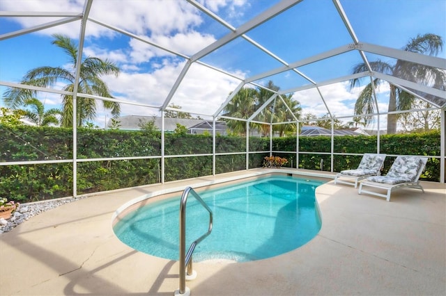 view of pool featuring a lanai and a patio area