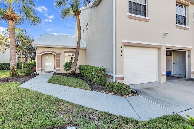 view of front of home with a garage