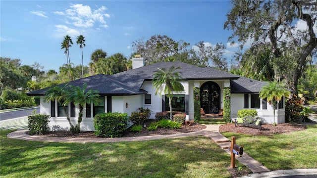 ranch-style home with a front yard