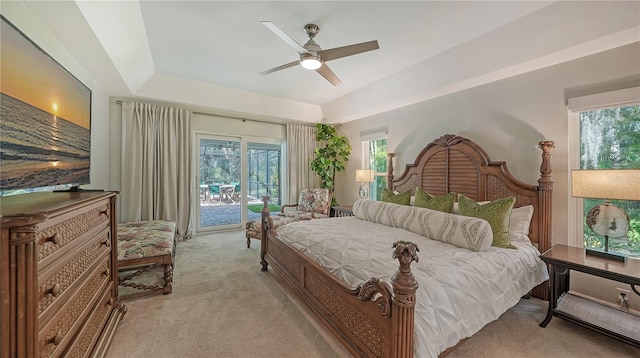 bedroom with access to exterior, ceiling fan, and light colored carpet