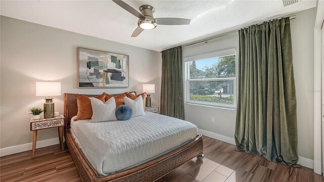 bedroom featuring ceiling fan and hardwood / wood-style flooring