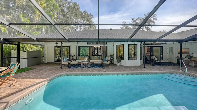 back of house featuring outdoor lounge area, ceiling fan, a lanai, and a patio