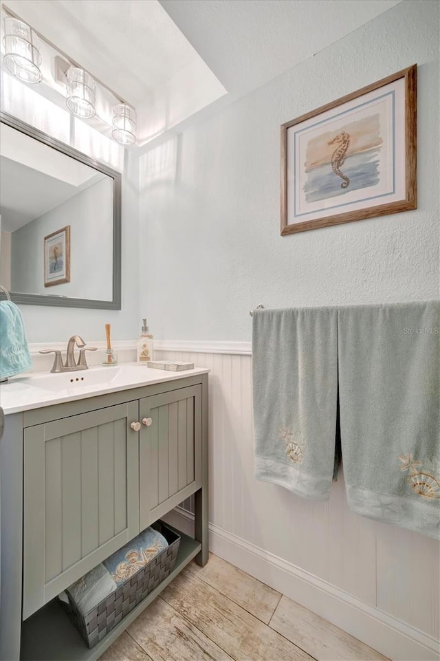 bathroom with vanity and wood-type flooring