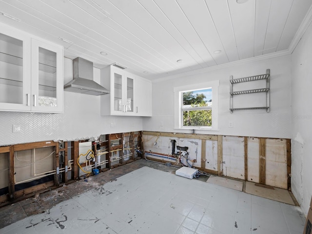 611 Hibiscus Way, Longboat Key, FL 34228 - kitchen featuring white cabinetry, ornamental molding, glass insert cabinets, and wall chimney range hood