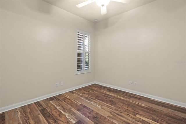 spare room featuring ceiling fan and dark wood-type flooring