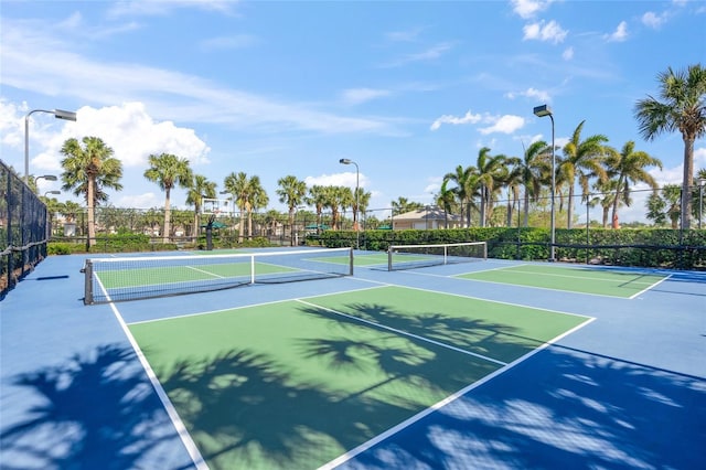 view of tennis court featuring basketball court