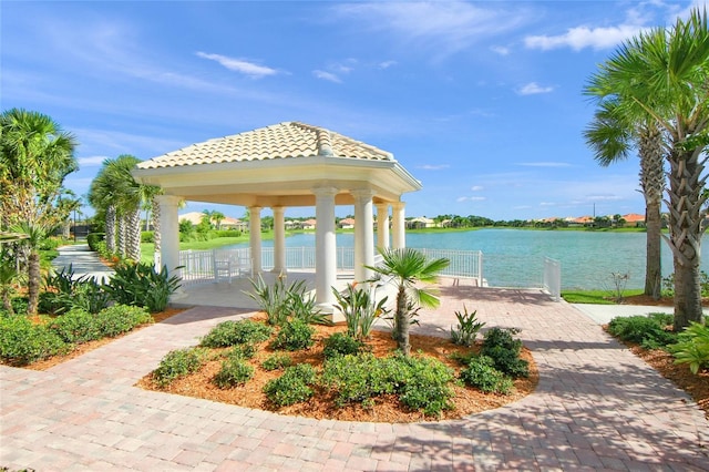 exterior space featuring a gazebo and a water view