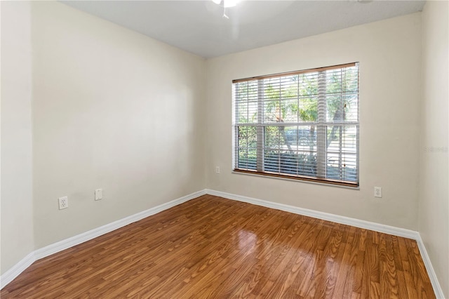 empty room with hardwood / wood-style flooring