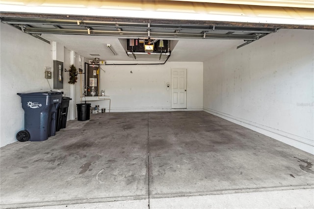 garage with electric panel and water heater