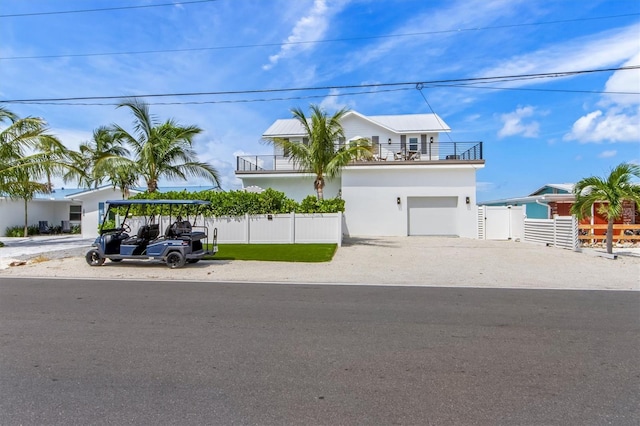 view of front of house with a balcony and a garage