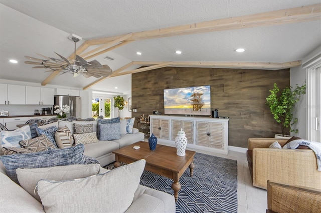 living room featuring french doors, a textured ceiling, ceiling fan, vaulted ceiling with beams, and wood walls