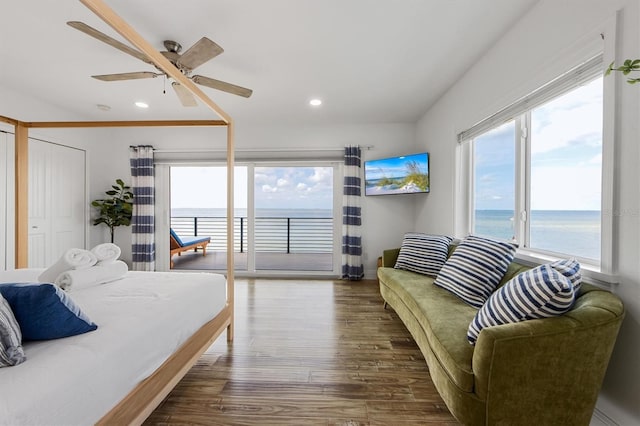 bedroom with access to exterior, ceiling fan, and dark hardwood / wood-style flooring