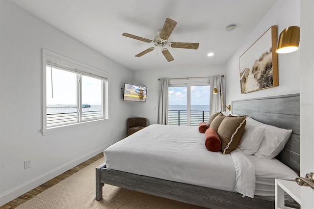 bedroom with hardwood / wood-style flooring and ceiling fan