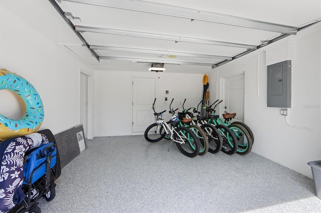 garage with electric panel and a garage door opener