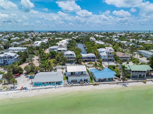 bird's eye view with a view of the beach and a water view