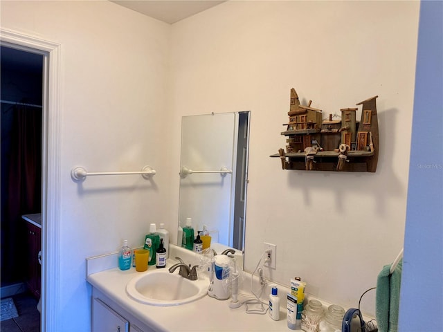 bathroom with tile patterned floors and vanity