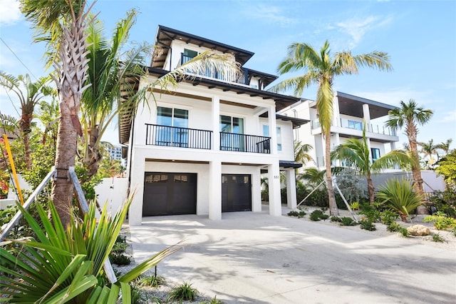 view of front of house with a balcony and a garage