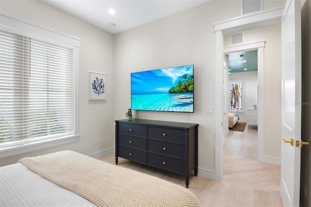 bedroom featuring multiple windows