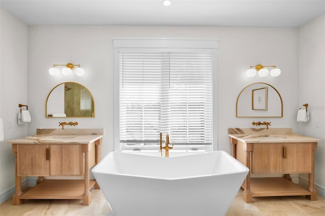 bathroom featuring a tub and vanity