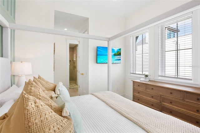 bedroom with multiple windows and ensuite bathroom