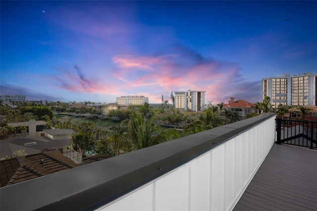 view of balcony at dusk