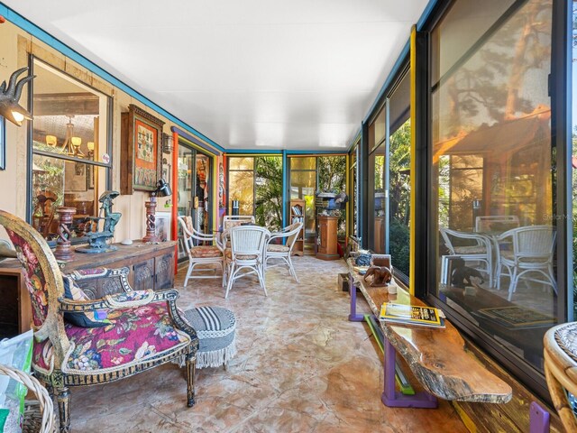 3888 Shady Brook Ln, Sarasota, FL 34243 - sunroom with outdoor dining space