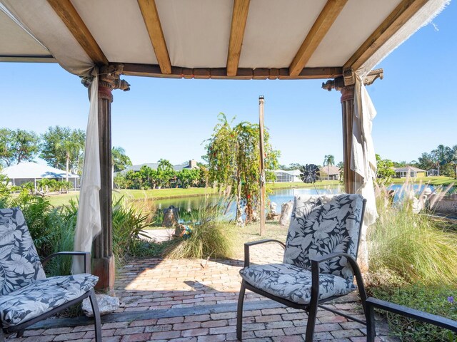 3888 Shady Brook Ln, Sarasota, FL 34243 - view of patio with a water view