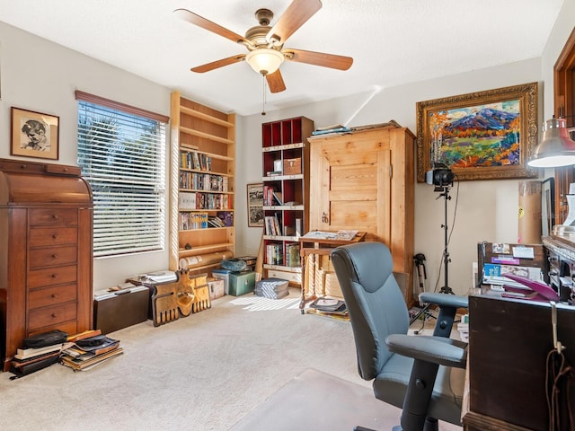 home office with carpet flooring and ceiling fan