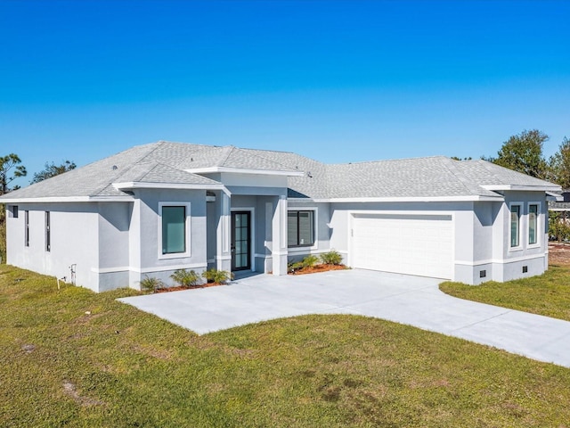 view of front facade featuring a front lawn and a garage