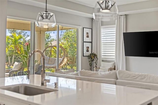 kitchen featuring sink and decorative light fixtures