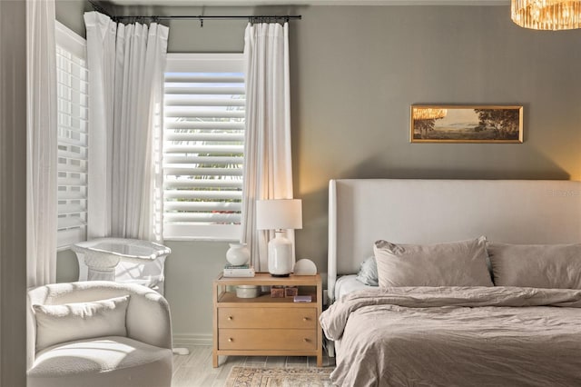 bedroom with light wood-type flooring