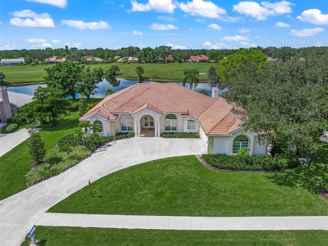 view of front of house featuring a front yard and a water view