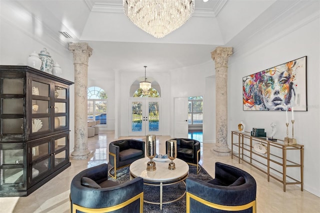 living area featuring french doors, decorative columns, ornamental molding, and a high ceiling