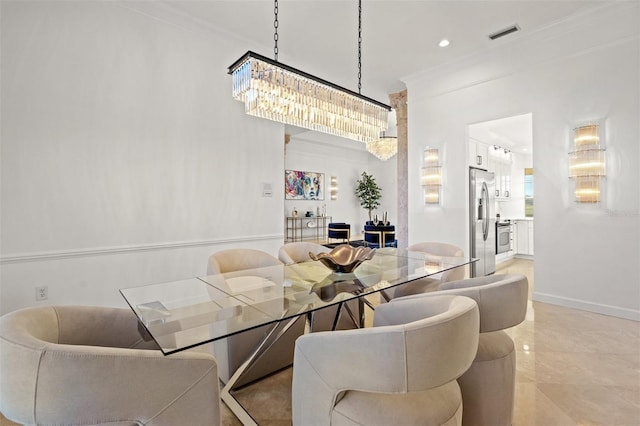 dining area with a chandelier and ornamental molding