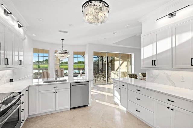 kitchen featuring appliances with stainless steel finishes, tasteful backsplash, an inviting chandelier, and sink