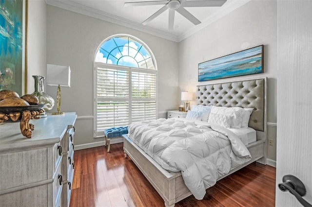 bedroom featuring ornamental molding, multiple windows, dark wood-type flooring, and ceiling fan