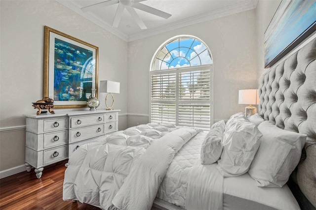 bedroom featuring ceiling fan, dark hardwood / wood-style flooring, and crown molding