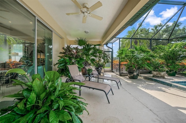 view of patio / terrace featuring ceiling fan and a lanai