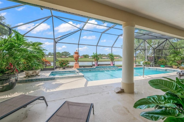 view of swimming pool with pool water feature, glass enclosure, an in ground hot tub, and a patio