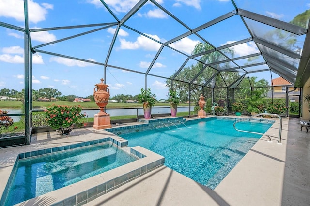 view of pool with a lanai, pool water feature, a patio area, an in ground hot tub, and a water view