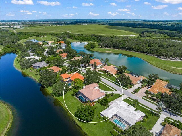 drone / aerial view with a water view