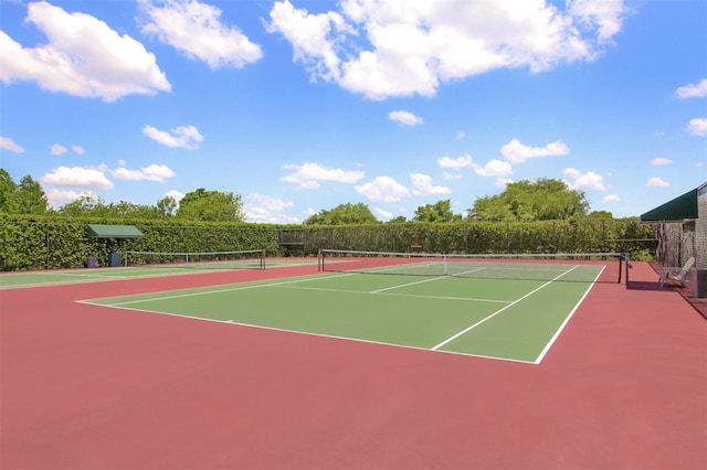 view of tennis court featuring basketball court