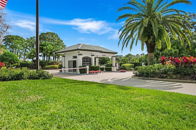 rear view of house with a lawn