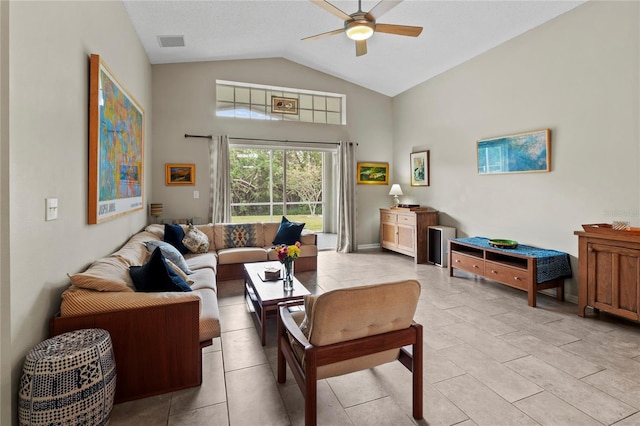 living room featuring ceiling fan and lofted ceiling